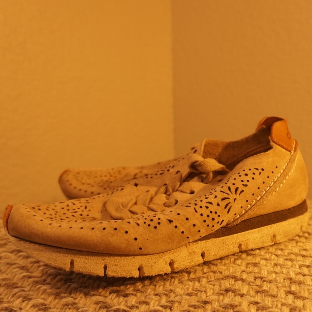 Stylish sneakers. Women’s (size 7). Tan color with beautiful cut out details.